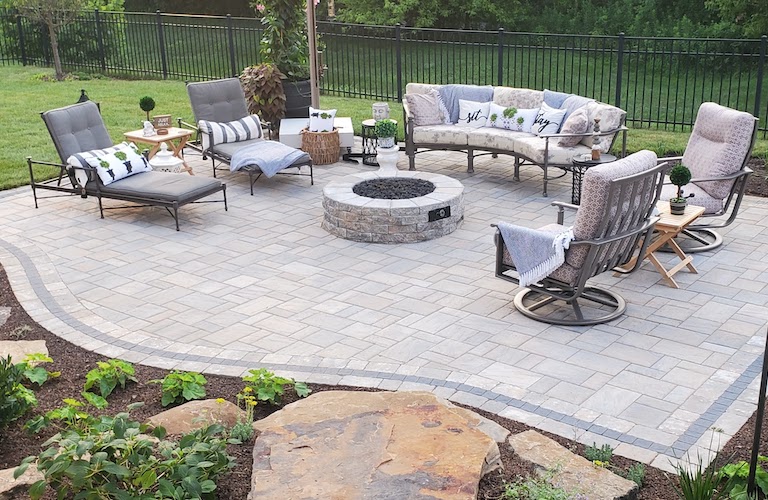Patio with deck furniture and a fire pit