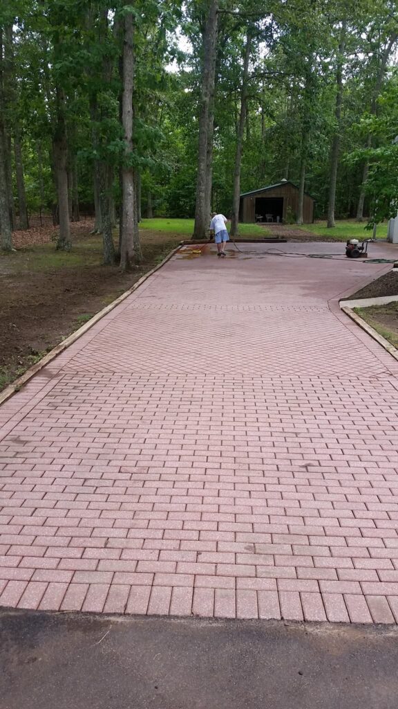 Paver driveway receiving new life with a power wash