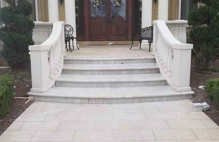 White stone steps with stone railing