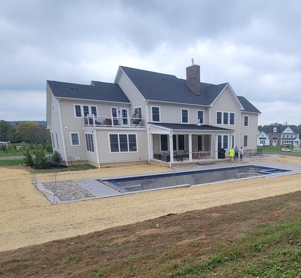 Straw matting covering recent sitework and grading around a new pool install